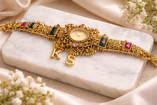 Golden wristwatch with initials